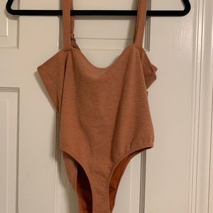 Peach-colored bodysuit
